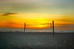 desert beach volleyball net at sunset