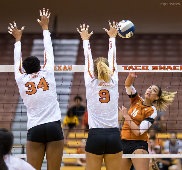 How to spike volleyball balls with 3 tactics: tip the ball short, tip it deep, roll shot, or cut shot when you need to score points in difficult situations.

(Texas orange and white scrimmage hitter hitting the cut shot. photo by Ralph Aversen)