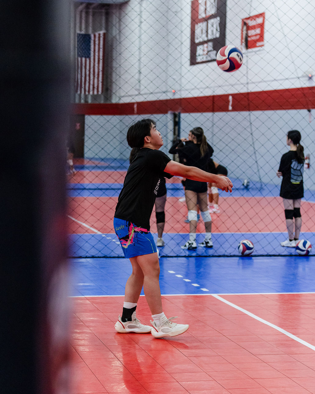 You would then use your "platform" to make contact with the ball, while angling your arms and shoulders to your target. This guides the ball to your target your setter or to another hitter or even across the net depending on where you want the ball to go. (Shots by Shanty)