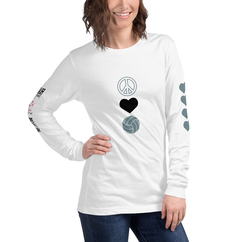 I specifically created my shirts to remind you of your strength and resilience, by including motivational quotes that speak directly to the challenges I know you face. (If Karma Doesn't Smack You on the back, I Will: Nope Nah Not Today on the Sleeve, Four hearts on one sleeve and peace love volleyball on the front)