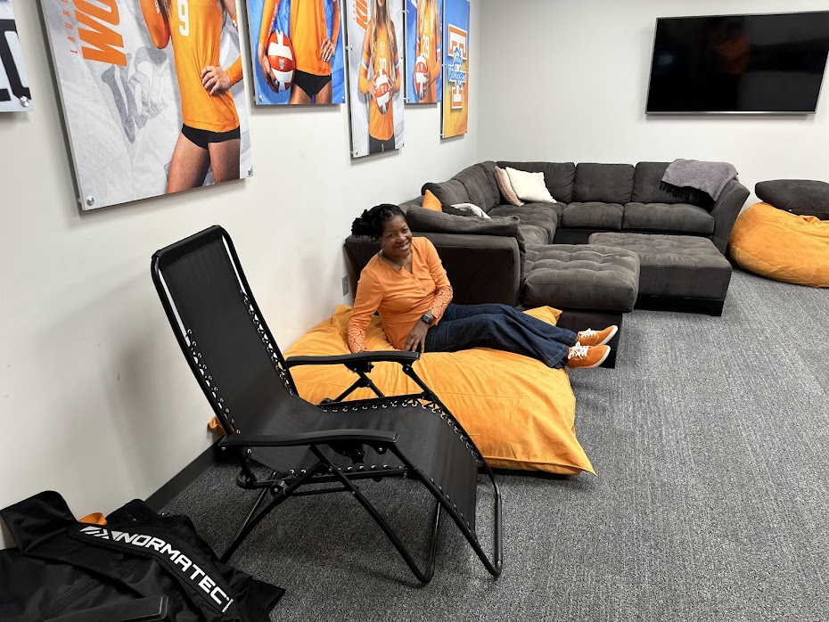 Coach April, that's me! on the UTK Player Lounge bean bag making myself at home in the Joan Cronan Volleyball Center during Champions Weekend on Nov 1, 2024.