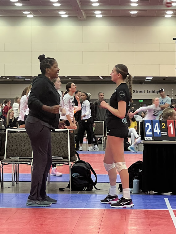 Coach April, three year Tstreet Las Vegas 18s coach, advises middle blocker Nicole McManus during the 18s Championships Baltimore Maryland. Nicole trained with April in the Breakfast Club for College Players sessions and is a freshman splaying for William & Penn volleyball team.