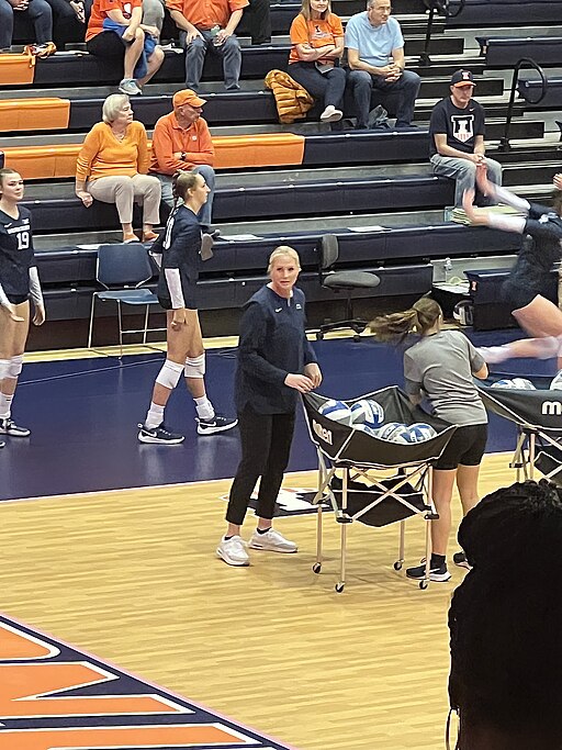 Katie Schumacher-Cawley, head volleyball coach at Penn State; Anjelina Starck practicing with the team before its match against Illinois on Oct. 26, 2022, at Huff Hall in Champaign, IL.