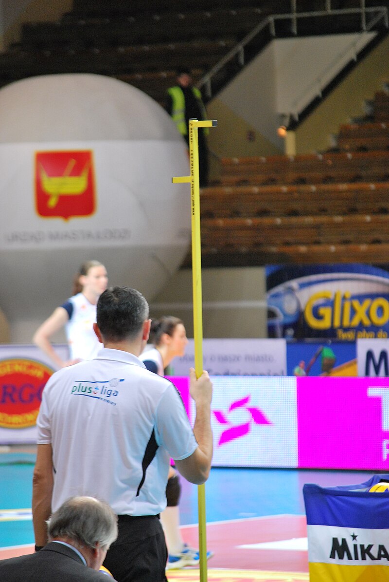 The volleyball referee job is to measure the height of the volleyball net. (photo by zorro2212)
(photo by zorro2212)