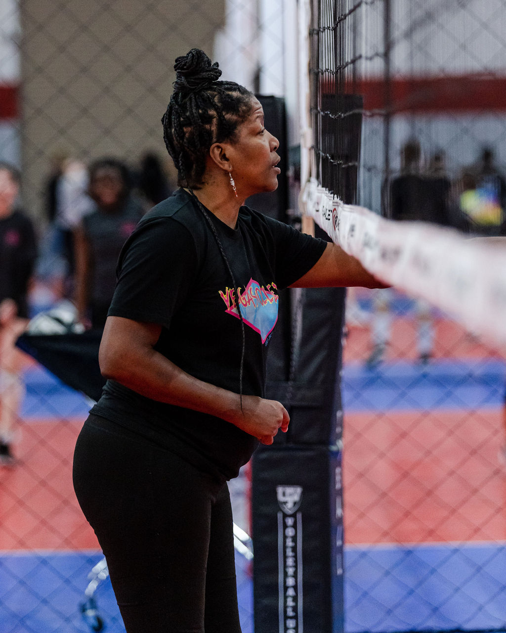 The right net can make the difference between recreational play and professional-level practice. (That's me Coach April at the volleyball net while coaching my Vegas Volley Girls 18s team)
Photo by Nicole Parnell