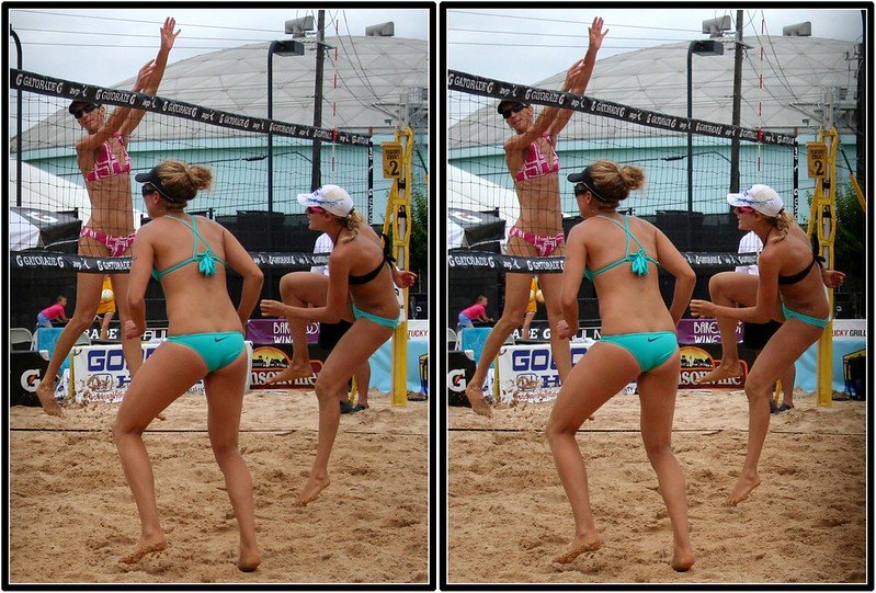 Beach volleyball professional Jen Kessy hits against blocker Dianne DeNocochea while partner April Ross watches (Fossil Mike)