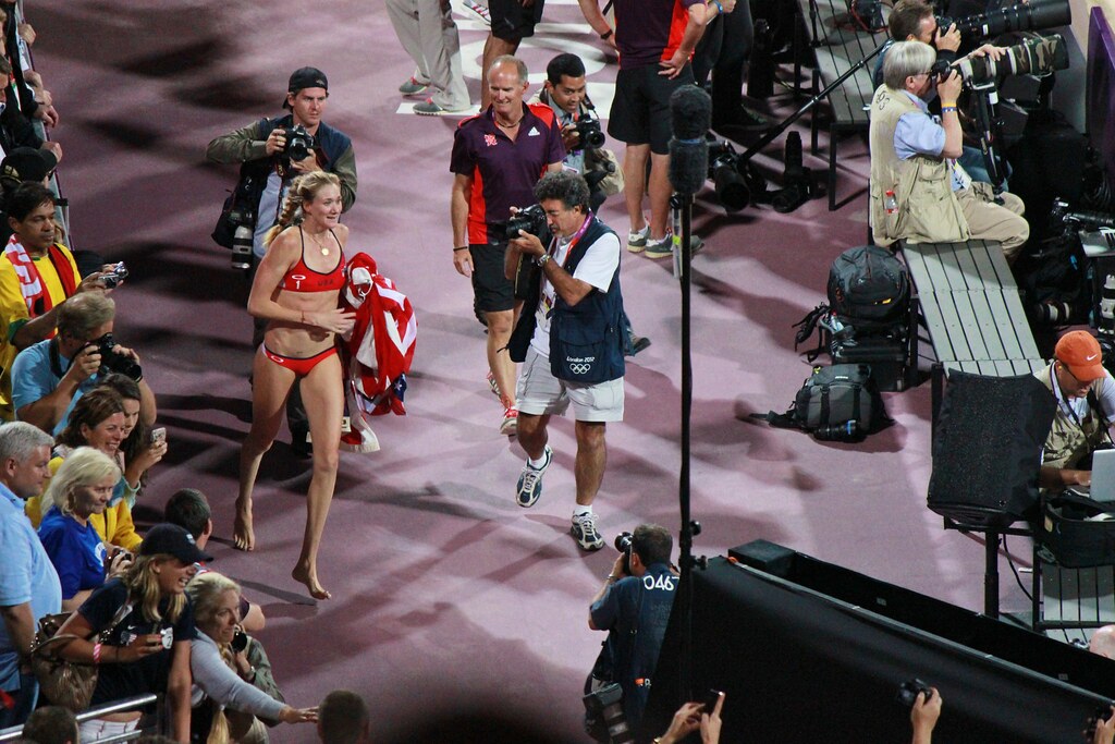 Kerri Walsh victory run with flag after winning the Olympic gold medal.