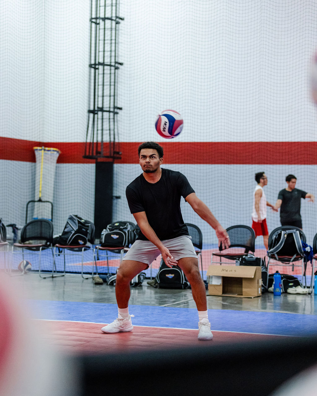 A good passer in volleyball watches as a ball coming over the net towards them decides early which side they will open up to ...getting their belly button out of the way, like you do when you play dodgeball, while creating their passing platform so they make contact with the ball when its outside of the body's midline. (Shots by Shanty)