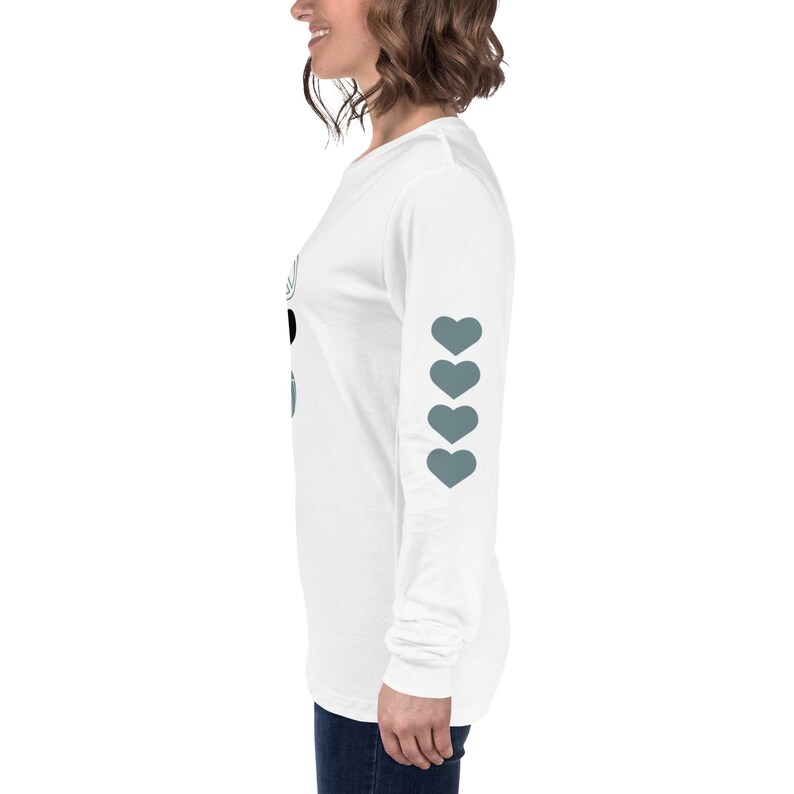 I've worked with tons of moms in this city and I know that as a volleyball mom in Las Vegas, you're navigating a unique landscape where the sport is exploding in popularity. (If Karma Doesn't Smack You on the back, I Will: Nope Nah Not Today on the Sleeve, Four hearts on one sleeve and peace love volleyball on the front)