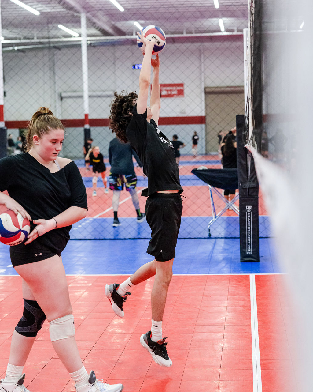 Whether you do drills at home by yourself, or you're doing them in practice with your teammates, it's best to get in the habit of setting mini goals for yourself to reach in order to complete each drill. (Sergio Vegas Volley 18s side setting during practice.)