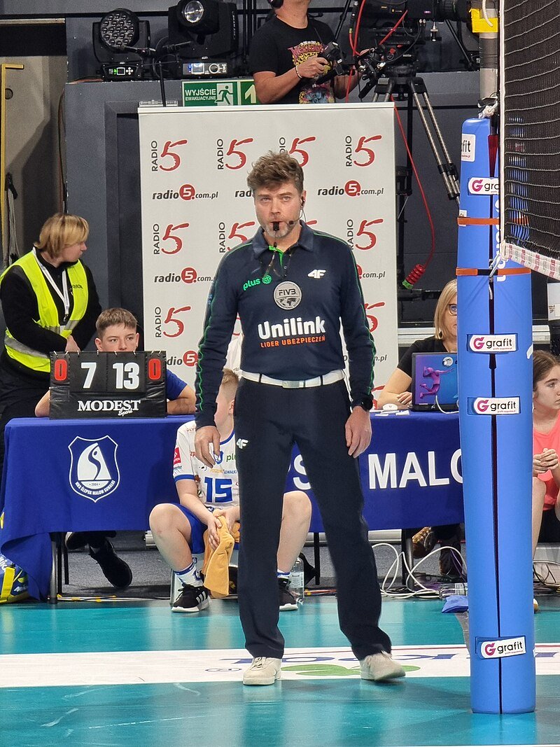 The second referee, one of the volleyball officials, sometimes known as the "down" referee assists and supports the first referee mainly by calling fouls that occur under the net.